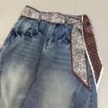 Retro blue denim jeans styled with a chic brown paisley print scarf as a stylish belt. - Double-Sided Paisley / 140x7cm / Coffee