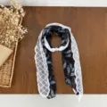 Black paisley skinny scarf with white lace trim and pearl buckle, elegant vintage neck accessory. - Coffee