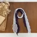 Elegant dark purple polka dot scarf with white lace trim and pearl buckle, detailed view. - Dark Purple