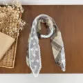 Detail shot of vintage plaid silk scarf with delicate white lace trim and pearl button accent. - HMS Soft Woven Check - Coffee Khaki