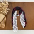 Detailed shot of a red plaid and white lace neck scarf with a delicate pearl buckle. - HMS - Striped Fringed Wine Red