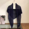 Detail view of the dark blue hollow-out knit triangular shawl, perfect for summer air-conditioning. - Navy Blue