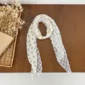 Floral lace scarf detail, elegant neckerchief with pearl accent, vintage literary style. - HMS Floral Embers - Apricot