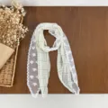 Detailed shot of green plaid lace scarf with pearl buckle, vintage style neckerchief accessory. - Yellow