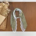 Close-up detail of Korean polka dot lace spliced pearl silk scarf fashion accessory. - HMS Forest Gauze - Green