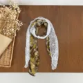 Green plaid scarf with white floral lace trim and pearl buckle, elegant neck accessory. - HMS Grid Shadow Floral - Yellow