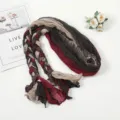 Detailed view of fashionable braided crinkled scarf with multi-color splicing design. - Jujube Red Spliced
