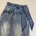 Detailed shot of stylish denim jeans featuring a retro paisley print scarf ribbon belt. Perfect trendy design. - Shock Paisley / 140x7cm / Navy Blue