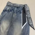 Vintage blue denim jeans featuring a chic black and white paisley and polka dot ribbon belt. - Multi-Face Paisley / 140x7cm / Black Base