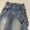 Close up detail of vintage paisley print ribbon belt on blue washed denim jeans, stylish retro design. - Quirky Paisley / 140x7cm / Black Base