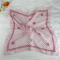 Detail shot of the pink gingham floral square scarf, showcasing delicate rose print. - 58-Harmony Pink