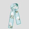 Light blue skinny silk scarf featuring white magnolia print and delicate calligraphy details. - PDPJ - White Magnolia