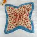 Close up of retro floral square scarf with blue border, vintage neckerchief detail. - LM58 - Red Flowers on Yellow Base with Blue Border
