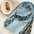 Retro light blue lightweight silk scarf with black leaf print, versatile fashion shawl. - WR Patchwork Leaves in Blue