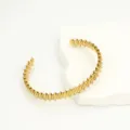 Golden serrated bracelet detail showcasing unique metallic block texture and polished finish. - Style 6 / Gold