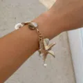 Pulsera de dijes de estrella de mar dorada con conchas y perlas para vacaciones en la playa. - Pulsera de Cuentas de Concha