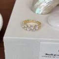 Gold vintage open ring for women featuring delicate purple enamel flowers and sparkling cubic zirconia. - Purple Flower Ring