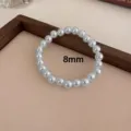 Elegante pulsera de perlas redondas de 8mm con cordón elástico, estilo francés minimalista. - 8mm / Gris