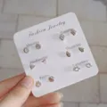 Conjunto de pendientes de tuerca de plata delicados para mujer, con formas geometricas. - Juego de 6 pendientes de botón geométricos