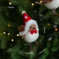 Detail view of the cute Christmas plush bird ornament with a red hat and bow tie. - Bird Style F