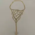 Elegant gold rhinestone foot chain anklet with toe ring, perfect for beach vacation style. - Ring-Linked Anklet (80603602) / Gold