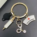 Cute nurse themed metal keychain with stethoscope and syringe charm accessory variant. - Black Mask Syringe Style (JE1583G)