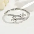 Silver rhinestone floral detail shot of hinged metal bangle bracelet close up showcase - Double Flower Hinge Style (80511301) / Silver