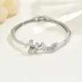 Detail shot of silver-toned flower bangle bracelet with "Love" script design for daily wear. - Love Letter Opal Floral Style (80513301)