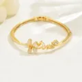 Gold flower bracelet jewelry with love text detail shot, elegant minimalist design for women. - Love Letter Opal Floral Style (80513302)