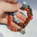 Ethnic ceramic beaded bracelet with multi-color glazed beads and lovely metal butterfly charm. - Sunset Glow