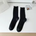 Black sheer hollow mesh mid-calf socks for women, vintage sweet ruffled lace design. - Polyester Material / Black