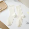 Women solid color crew socks, casual cotton mid-tube socks, comfortable daily wear, beige. - One Size / Cream