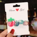 Cute strawberry and shiny beads elastic hair tie for kids, detailed close-up view of accessory. - Strawberry Hair Tie