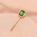 Detailed close-up of a gold-plated hair clip featuring a vibrant green crystal and rhinestone halo. - Single Stone Clip (S34) / Fruit Green
