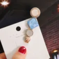 Close-up detail of a fashionable geometric hair clip with pearl and blue resin square design. - Individual Packaging / Tower Blue