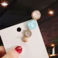 Korean style multi-element hair clip with pearl and glitter resin design for women fashion. - Individual Packaging / Tower Lake Blue
