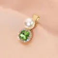 Detail shot of a vintage green rhinestone hair clip featuring a large pearl and shiny crystals. - Rhinestone Pearl Clip (S34) / Fruit Green