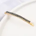 Detailed view of a golden double-row rhinestone bobby pin, stylish hair accessory for women. - Curved Hair Clip / Silver Dark Rhinestone