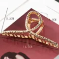Golden metal hair claw clip with hollow geometric design, elegant hair accessory for women. - Crisscross Hollow Oval Structure (S157-8) / 11.7cm