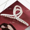 Large metal hair claw clip with unique geometric design and textured finish for elegant styling. - Irregular Streamlined Intertwined Design (S157-9) / 11.7cm