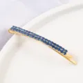 Elegant gold tone bobby pin featuring double rows of sparkling blue rhinestones for women. - Curved Hair Clip / Gold Dark Blue
