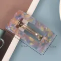 Detailed closeup of rectangular acetate hair barrette featuring colorful marbled pattern. - Acetate Spring Clip / Dreamy Colorful