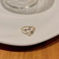 Adjustable gold-tone open ring featuring a pink heart cubic zirconia stone and sparkly gems. - Gold Heart Ring