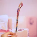Detailed view of colorful acetate hair stick with hollow cloud pattern, perfect for buns. - 17.6cm / Patterned