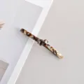 Elegant tortoiseshell acetate hair clip with knot design for stylish ponytail styling. - Long Twisted Knot Spring Clip (12#)