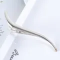 Detailed view of silver metallic S-shaped curved hair duckbill clip with brushed texture. - 13.2CM / Silver