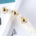 Closeup detail view of a trendy Korean style minimalist gold pearl rhinestone banana hair clip. - 12# Pearl Rhinestone Banana Clip