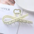 Metal hair claw clip detail close-up showing the unique heart design and smooth matte finish. - Heart Hollow Design Style (82#) / 11.3cm / Cream