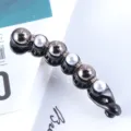 Detail shot of black banana hair clip adorned with pearls, rhinestones and metallic beads. - 7# Pearl Rhinestone Banana Clip