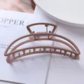 Close up of a minimalist matte pink geometric metal hair claw clip, perfect for stylish updos. - Semicircular Arch Geometric Style (97#)